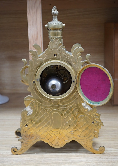 A late 19th century gilt bronze rococo style mantel clock, with pendulum, 38cm tall. Condition - fair, not tested